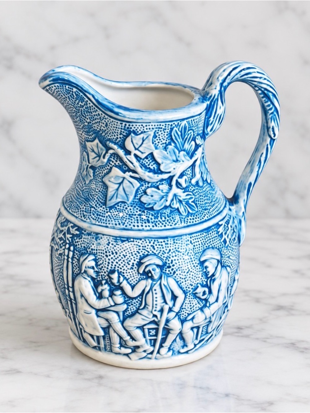 Vintage blue and white water pitcher with a Meissen style design